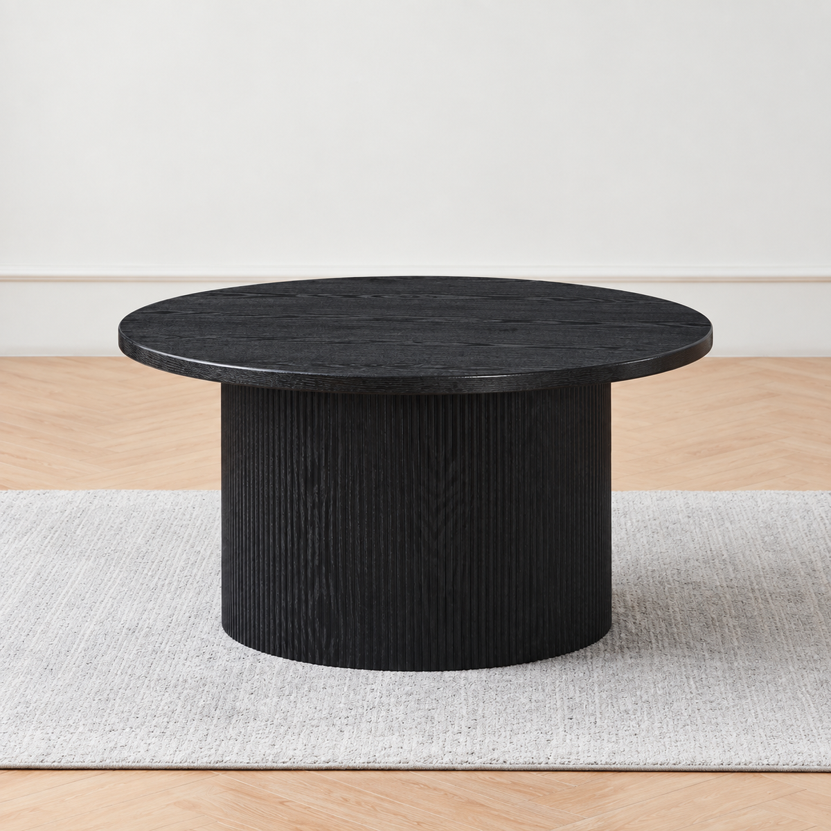 Modern Black Round Coffee Table with Fluted Pedestal Base