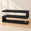 High-gloss black and chrome 48-inch TV stand in a warm living room, with no TV