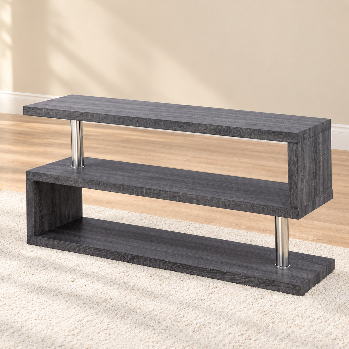 Grey and chrome 48-inch TV stand with staggered shelves in a warm living room, with no TV