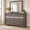 Seville Weathered Grey dresser and mirror in a bedroom lifestyle setting