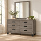 Olivia Taupe dresser and mirror in a bedroom lifestyle setting